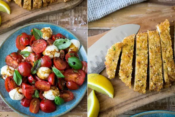 Tomate Mozzarella Salat mit frischem Basilikum und paniertes Schnitzel, dazu Zitronenspalten.